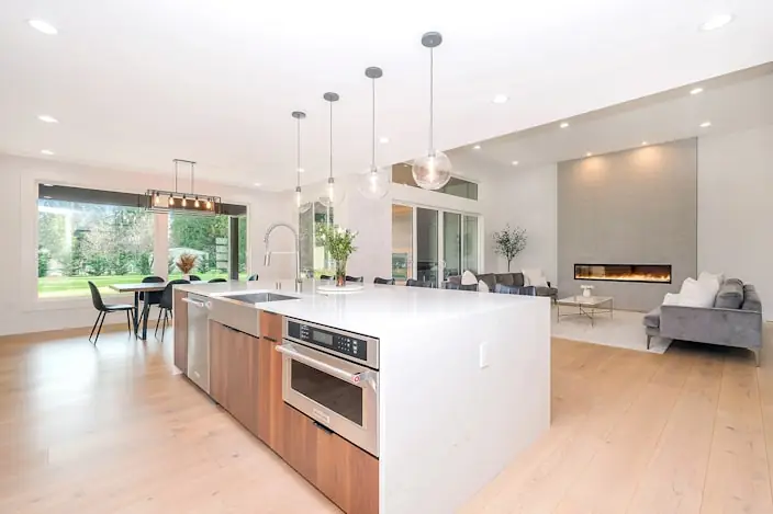 Second kitchen with island seating and open sightline to the living area