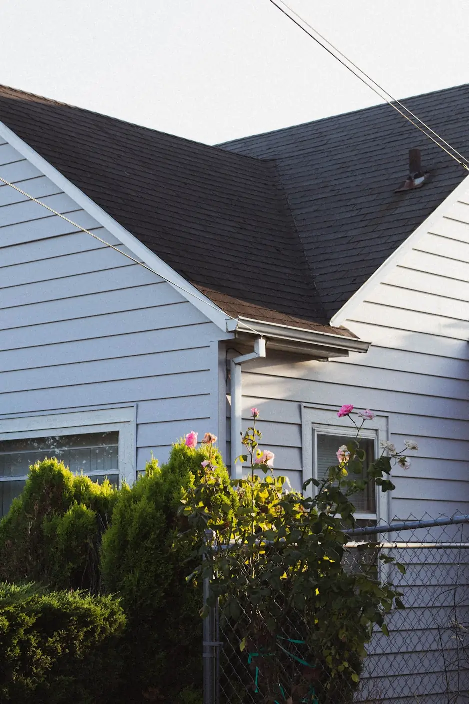 Steep asphalt shingle roof on a two story home